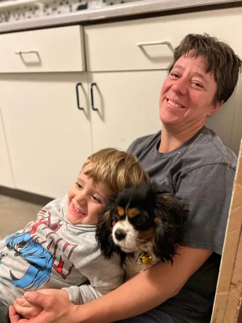 Therapy Dog in parents lap