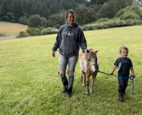 walking therapy animal with parent